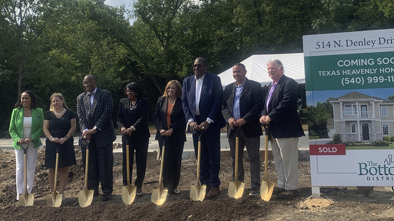 Group photo with shovels to display new building area