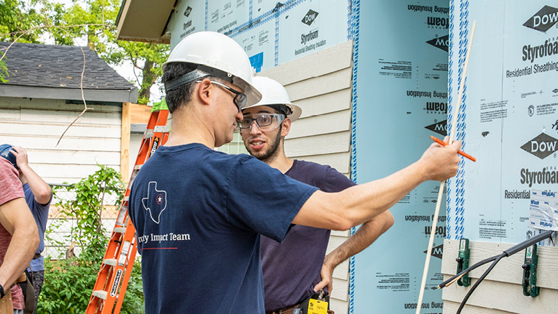 Volunteer working on a house