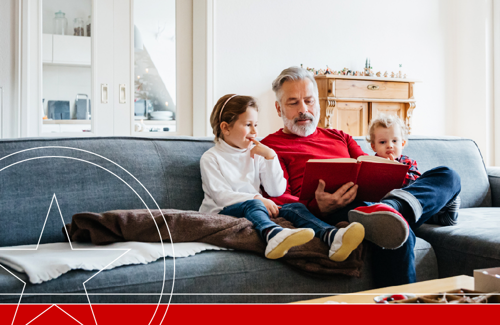 Man and children reading on couch