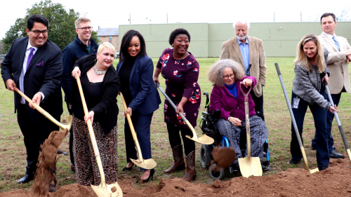 volunteers with shovels digging