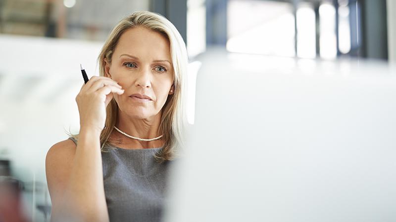 woman looking at computer