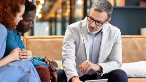Personal <br>Banking</br> people looking at laptop
