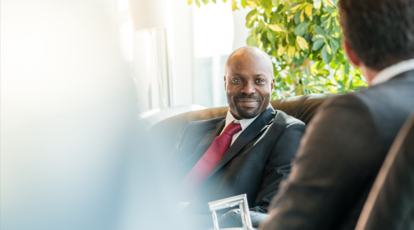 Businessmen sitting on chair at airport