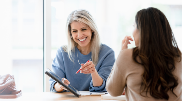 Two ladies viewing a tablet