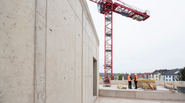 Workers watching crane on jobsite