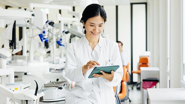 Woman Dentist on tablet